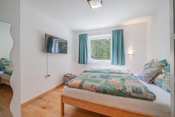 Slaapkamer bij Chalet-appartement Leiter
