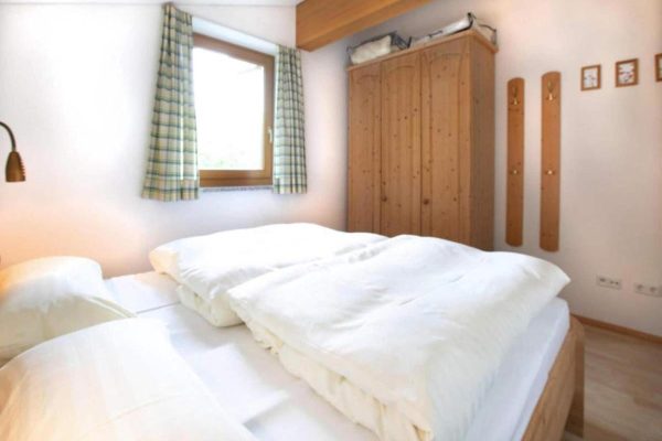 Slaapkamer bij Chalet-appartement Bärlerhof